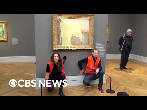 Climate activists throw mashed potatoes on a Monet painting to protest fossil fuel extraction