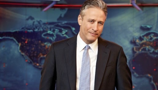 Jon Stewart wearing a suit and tie