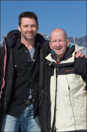 Hugh Jackman, left, poses with Eddie Edwards on the set of EDDIE THE EAGLE.