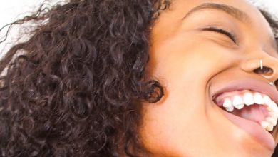 A close up of a woman with her mouth open