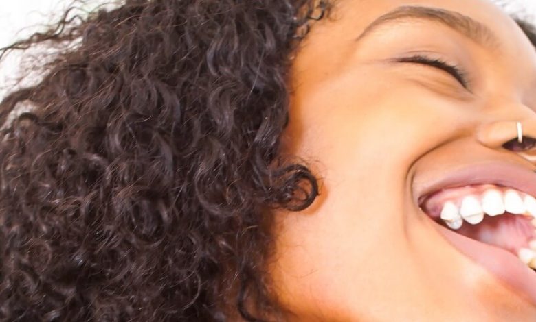 A close up of a woman with her mouth open