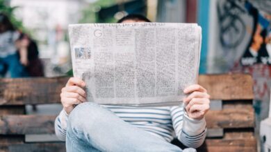 A person reading a newspaper