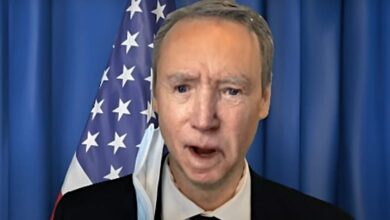 Kyle Dunnigan Joe Biden mask on ear