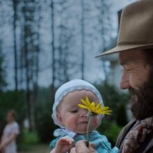 TRAIN_DREAMS_review Joel Edgerton and baby