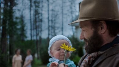 TRAIN_DREAMS_review Joel Edgerton and baby