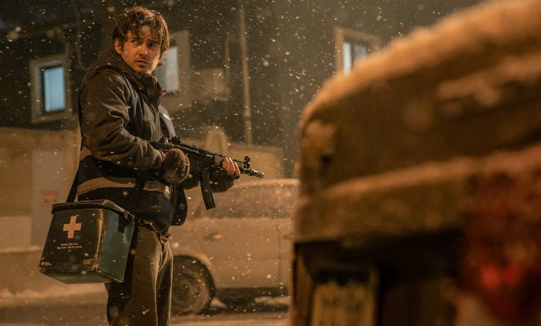 Resident Evil review Austin Abrams with rifle-